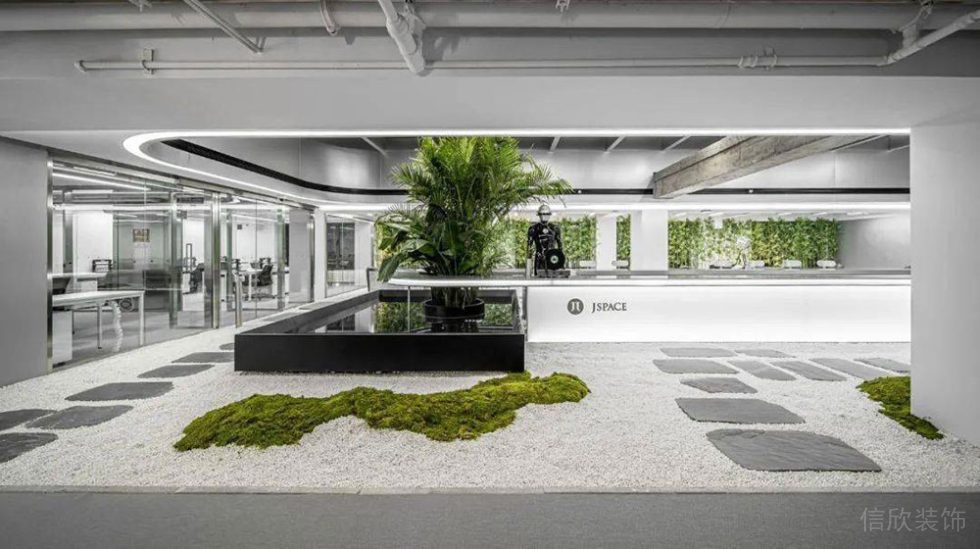 现代工业风办公空间绿植休闲区设计装修图