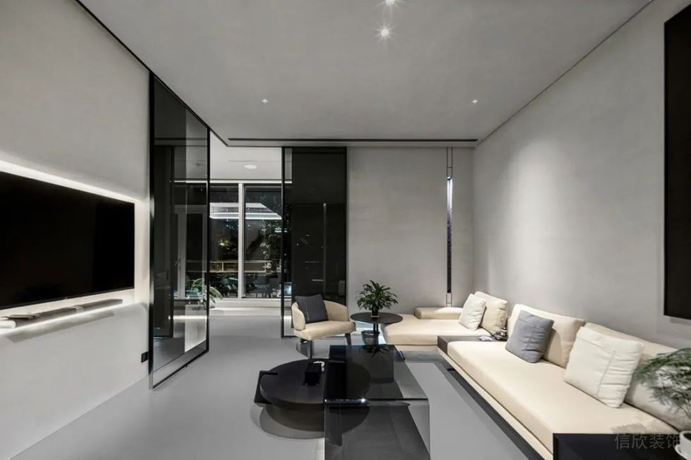 极简黑白灰风格办公室装修案例接待室米白色转角沙发