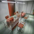 机械工业风办公室装修设计橙色主题会议室效果图
