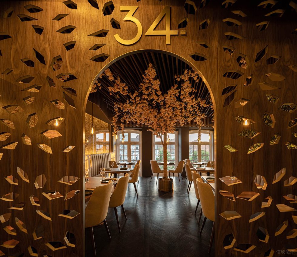 现代东南亚风西餐厅圆弧门洞装修设计