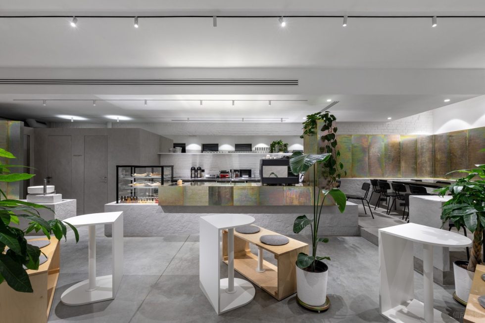 现代极简风咖啡厅暗灰色wc墙体点缀白色空间设计效果图